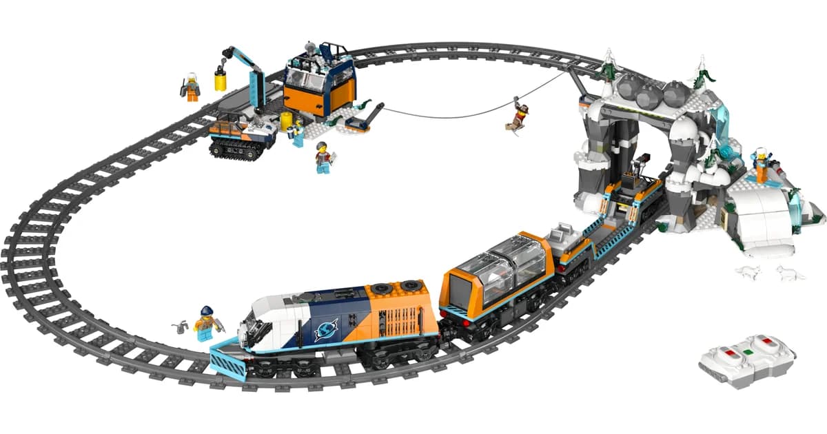 LEGO City Explorers' Arctic Polar Express Train 60470 on an oval of track with a snowy tunnel, an outpost, minifigures and a remote