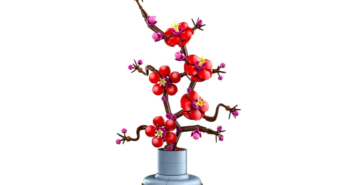LEGO Botanicals Plum Blossom 10369, a red-flowered brick-built branch in a small blue vase, on a white background