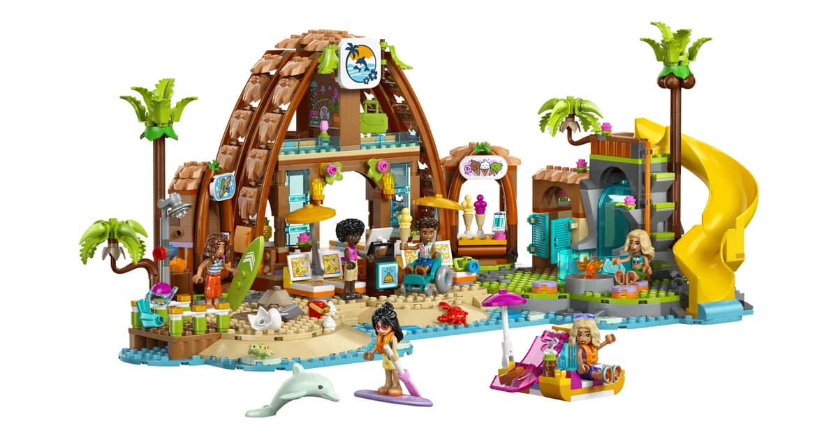 LEGO Friends Family Vacation Beach Resort 42673 with a curved wooden roof, palm trees, a yellow slide, a dolphin and mini-dolls