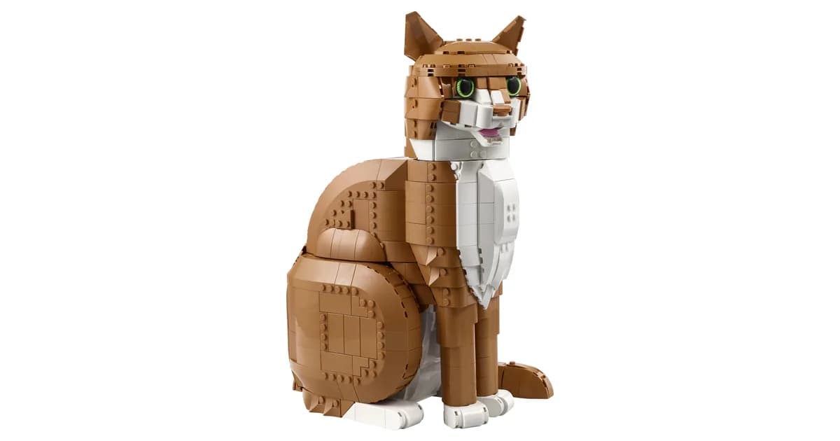 LEGO Ideas Orange Cat 21376, a seated ginger and white brick-built cat with green eyes, on a white background