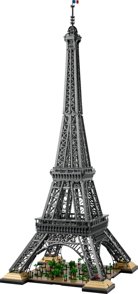 LEGO Icons Eiffel Tower 10307, a tall grey lattice tower on a base with small green trees