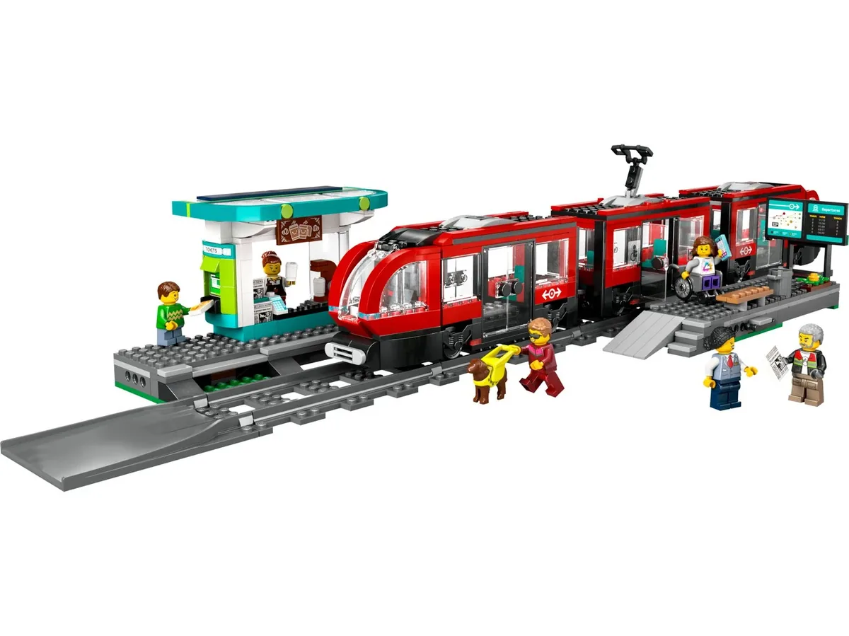 LEGO City Downtown Streetcar and Station 60423: a red three-section streetcar on grey track beside a small station with minifigures