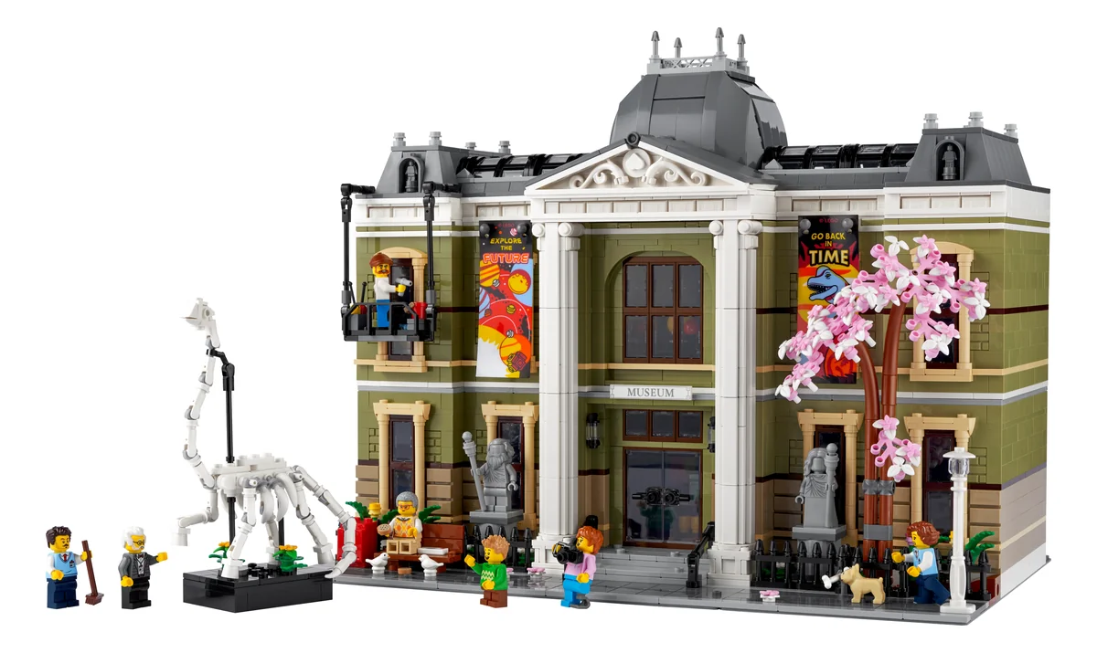 The LEGO Icons Natural History Museum 10326, an olive-green museum with white columns and a dinosaur skeleton outside, marked 18+