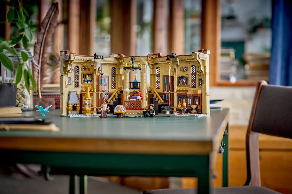 LEGO Harry Potter Book Nook Dumbledore's Office 76478 opened flat on a green table with minifigures in front