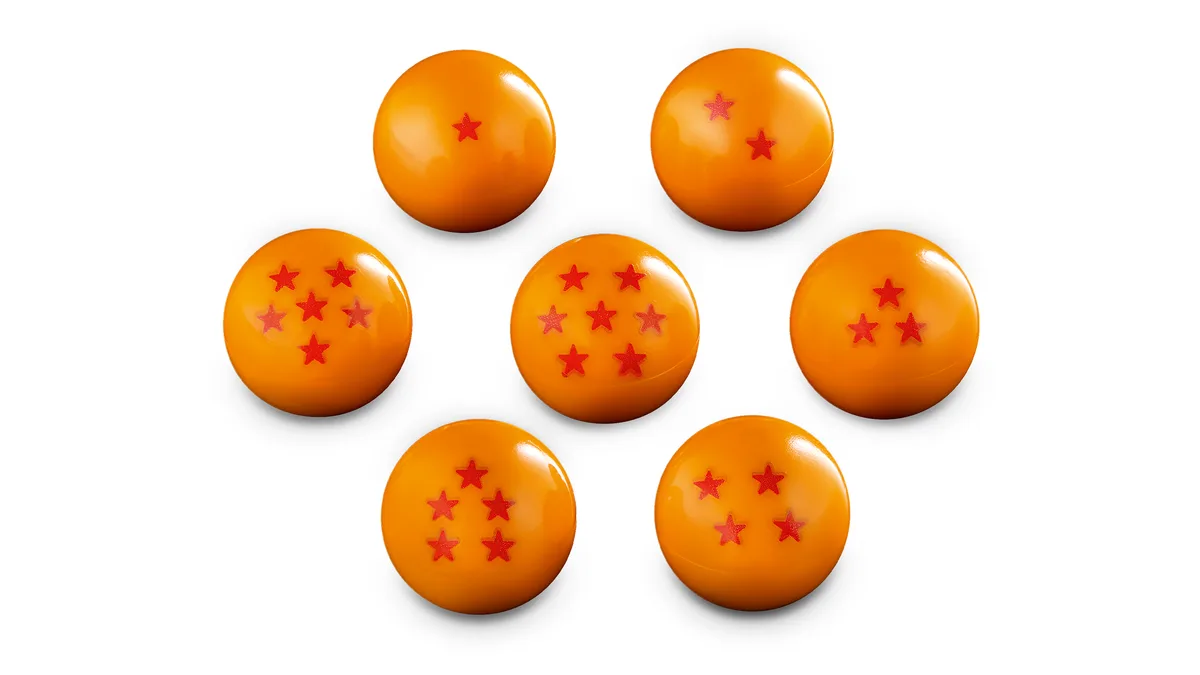 Seven orange Dragon Balls, each marked with one to seven red stars