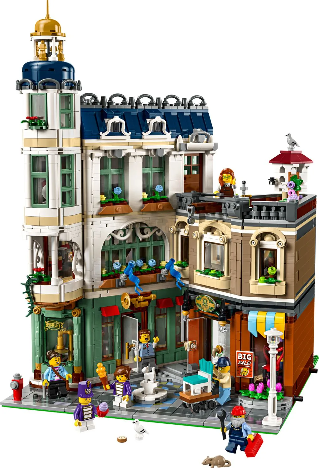 LEGO Icons Shopping Street 11371, a corner building with shop fronts, a striped awning, a rooftop terrace and minifigures on the pavement