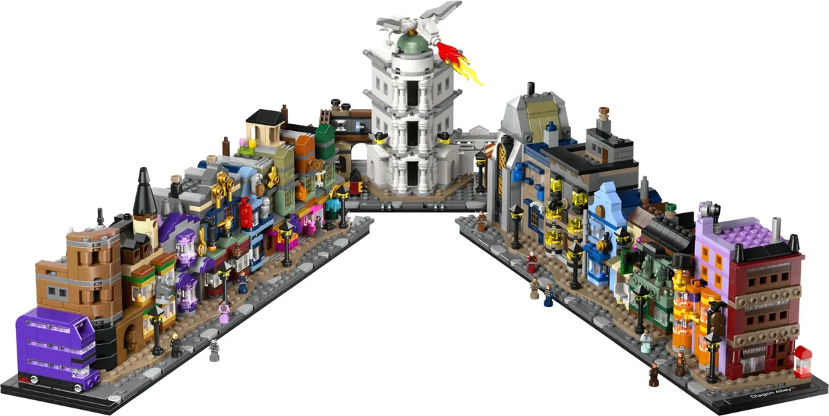 LEGO Harry Potter Diagon Alley Wizarding Shops 76444: a long curved street of shopfronts with a white bank tower and a purple Knight Bus at one end