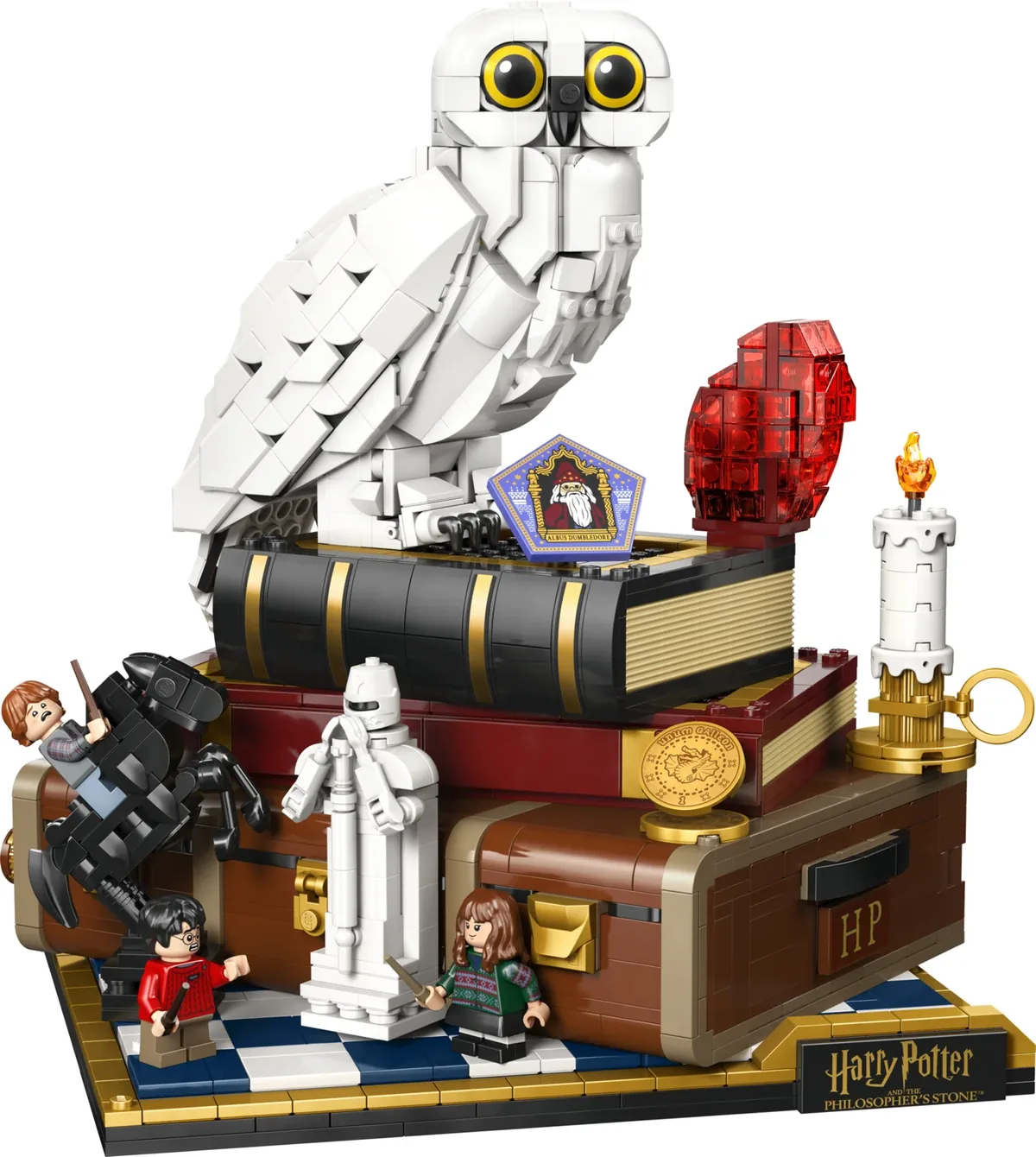 LEGO Harry Potter Sorcerer's Stone Collectors' Edition 76466: a white Hedwig owl on a stack of books with a red stone, a candle and minifigures on a chessboard base