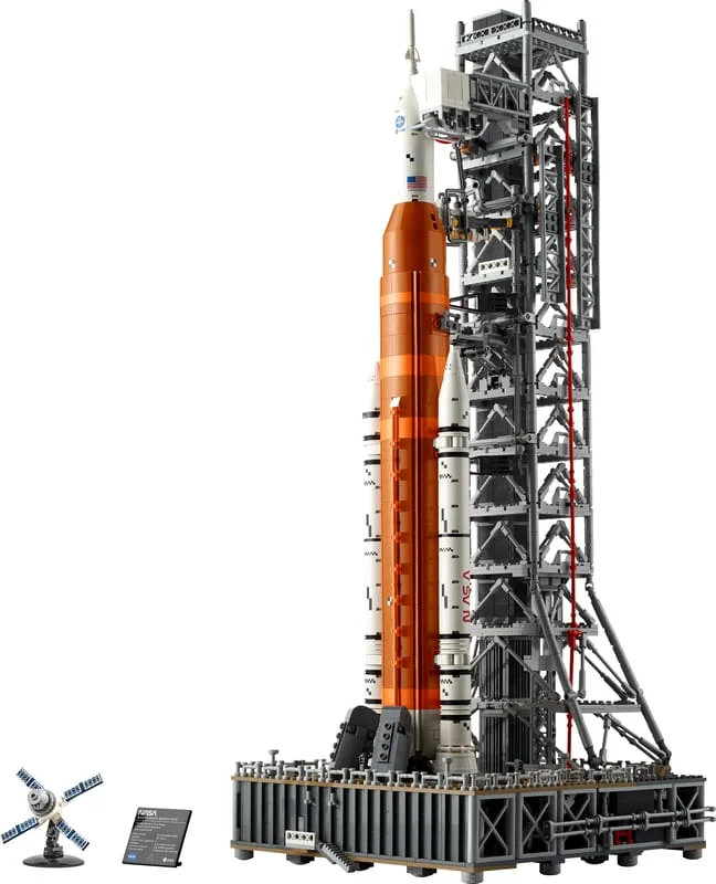 The LEGO Icons NASA Artemis Space Launch System 10341, an orange and white rocket on its grey launch tower and mobile platform