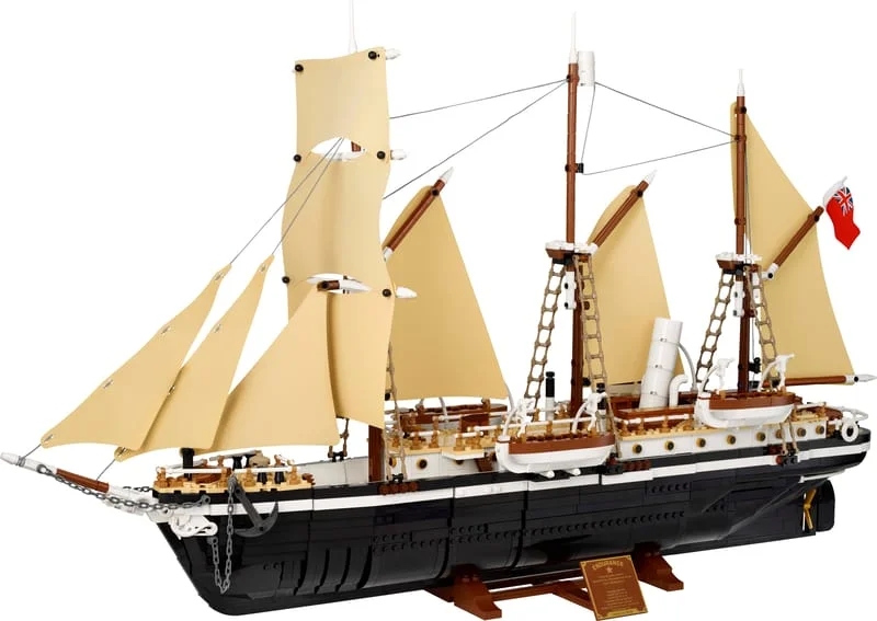 The LEGO Icons Endurance 10335, a three-masted ship with cream sails and a black hull, on a brown display stand