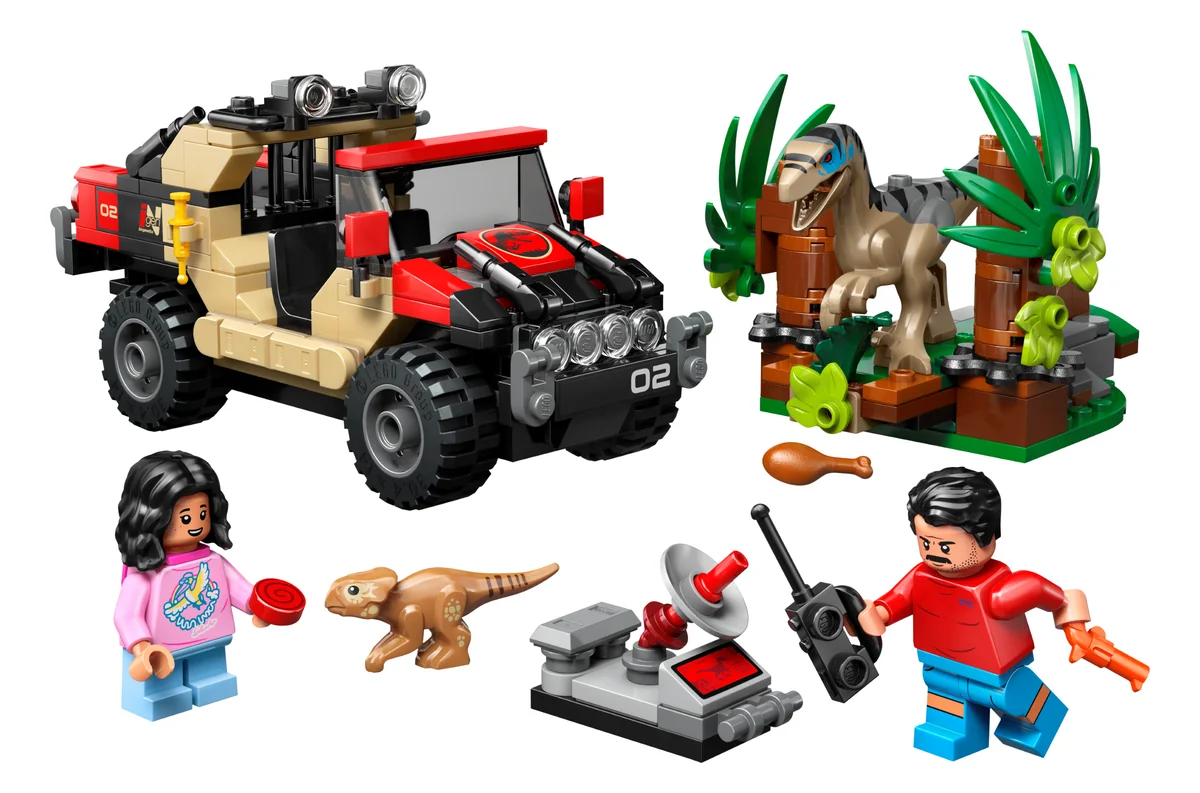LEGO Jurassic World Raptor Off-Road Escape 76972, a black and red off-road vehicle, a Velociraptor in green bushes and two minifigures with a tracking device
