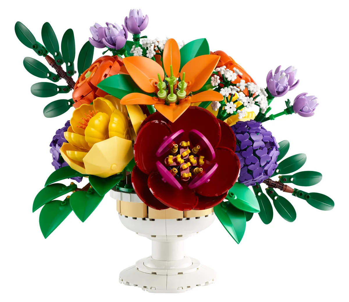 LEGO Botanicals Flower Arrangement 10345, a large bouquet of orange, red, yellow and purple brick-built flowers with green leaves in a white footed vase