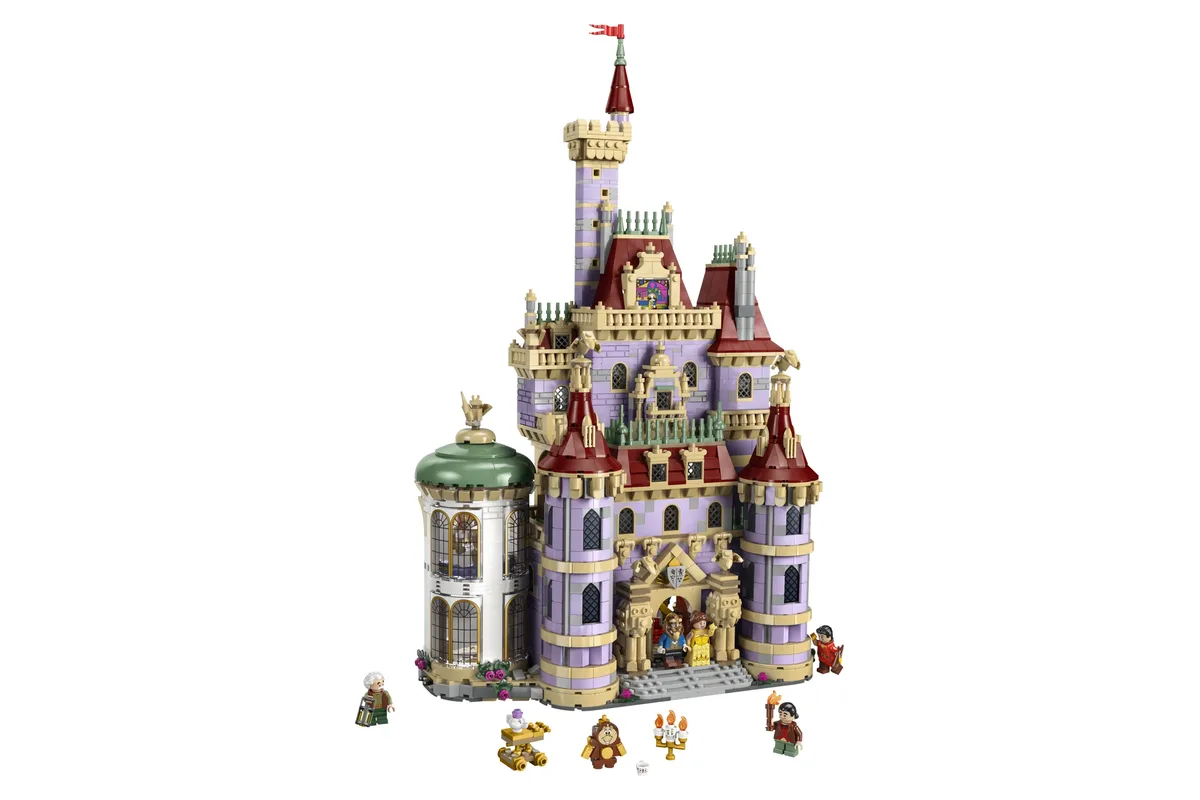 LEGO Disney Beauty and the Beast Castle 43263 with towers, a lilac roof and character minifigures at its base