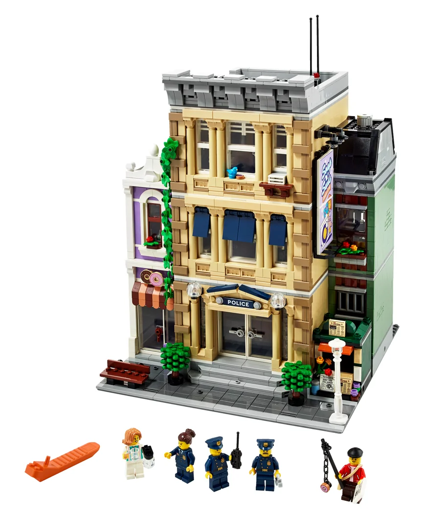 LEGO Police Station 10278, a tall tan police station with a narrower building beside it and police minifigures in front