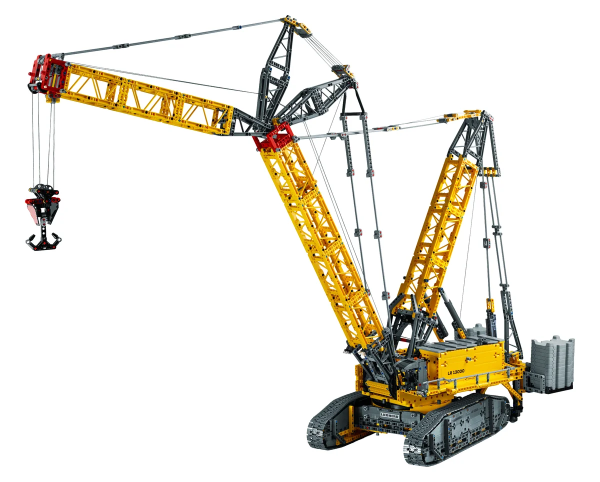 LEGO Technic Liebherr Crawler Crane LR 13000 42146, a tall yellow lattice crane boom on black crawler tracks with a hook and counterweights